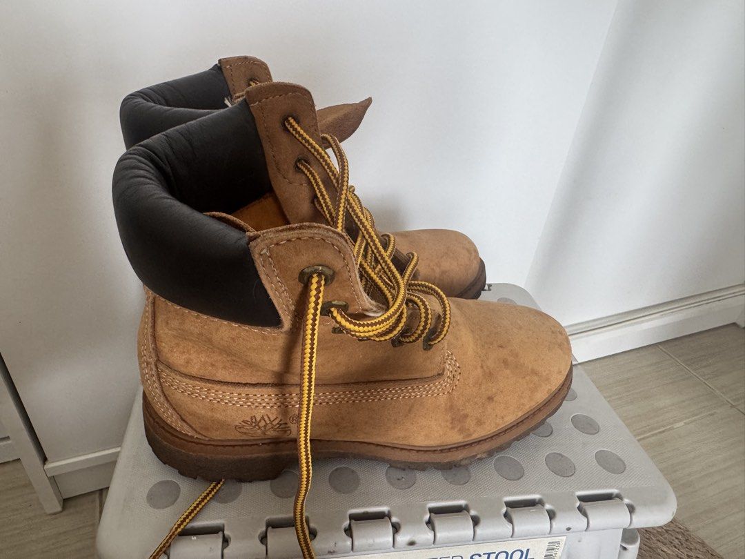 Timberland Style Work Boots Tan Suede Lace Up (Category: Boots) located in Makati City. Submitted by toto_thriftshop2022 (Listing ID 1449344080, Image 1). Description: - Classic tan suede work boots - Black padded collar - Yellow and black laces - Chunky rubber sole for excellent grip - Perfect for outdoor adventures or casual everyday wear - Shows minor scuffs and dirt marks from normal use.
