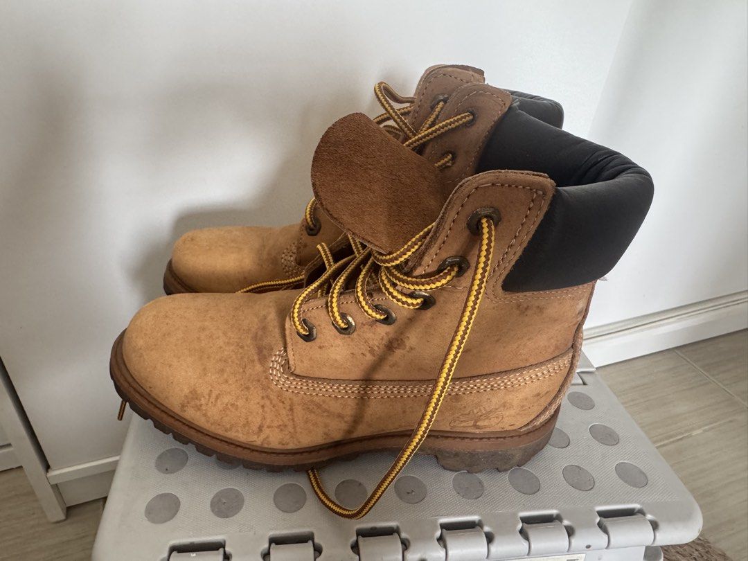Timberland Style Work Boots Tan Suede Lace Up (Category: Boots) located in Makati City. Submitted by toto_thriftshop2022 (Listing ID 1449344080, Image 3). Description: - Classic tan suede work boots - Black padded collar - Yellow and black laces - Chunky rubber sole for excellent grip - Perfect for outdoor adventures or casual everyday wear - Shows minor scuffs and dirt marks from normal use.