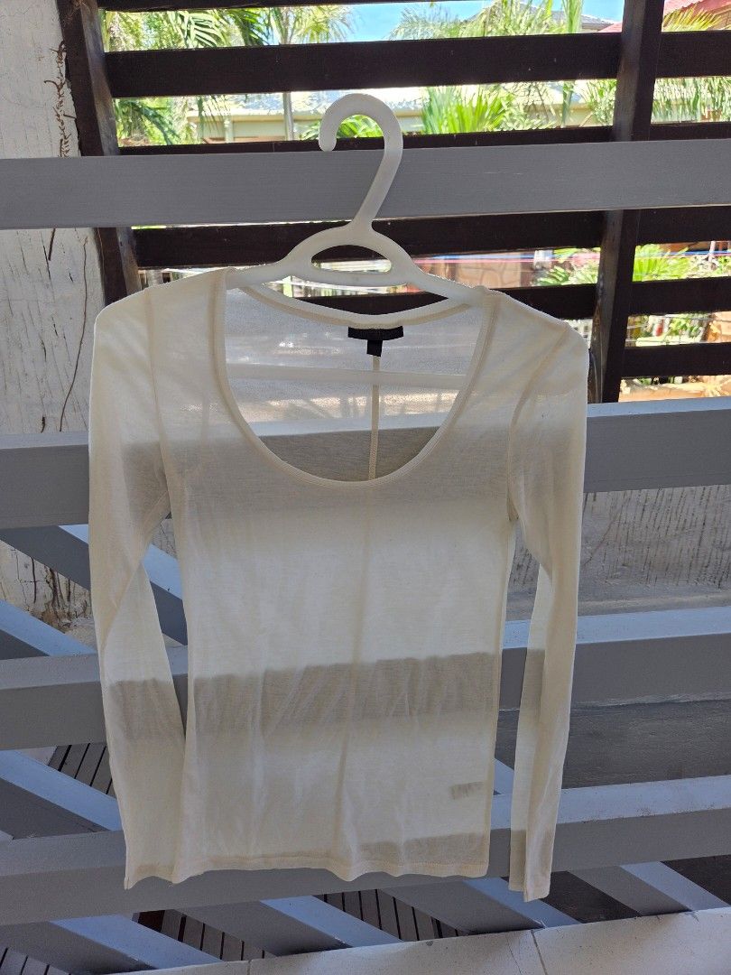 TOPSHOP White Sheer Long Sleeve Top (Category: Longsleeves) located in Quezon City. Submitted by sdp_enterprise (Listing ID 1449339268, Image 3). Description: - White sheer long sleeve top - Brand: Topshop - Neckline: Scoop neck - Width: 16 inches - Fabric: Lightweight and airy - Style: Great for layering or wearing on its own, perfect for a casual look.