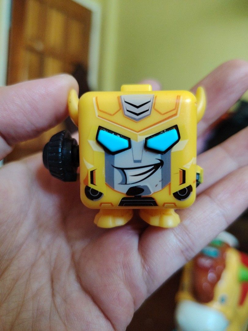 Transformers Bumblebee fidget Cube Figure (Category: Designer & Blind Box Toys) located in Iligan City. Submitted by shehabdor98515 (Listing ID 1449357792, Image 1). Description: - Adorable Bumblebee cube toy - Classic yellow design with signature face - Compact and portable size - Ideal for display or play - A must-have for Transformers fans.