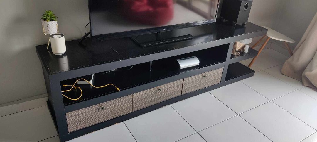 TV Cabinet with Storage (Category: TV Consoles) located in Seri Kembangan. Submitted by jit_004 (Listing ID 1449504814, Image 2). Description: Dimension: L182 x W40 x H48.5(CM) Selling a black TV console. It has drawers and open shelves for storage. Plenty of space for your media devices and decor. Some minor wear on the corners, as shown in photos. Still sturdy and functional. Great for organizing your living room. Note: 1) Offering no free deli