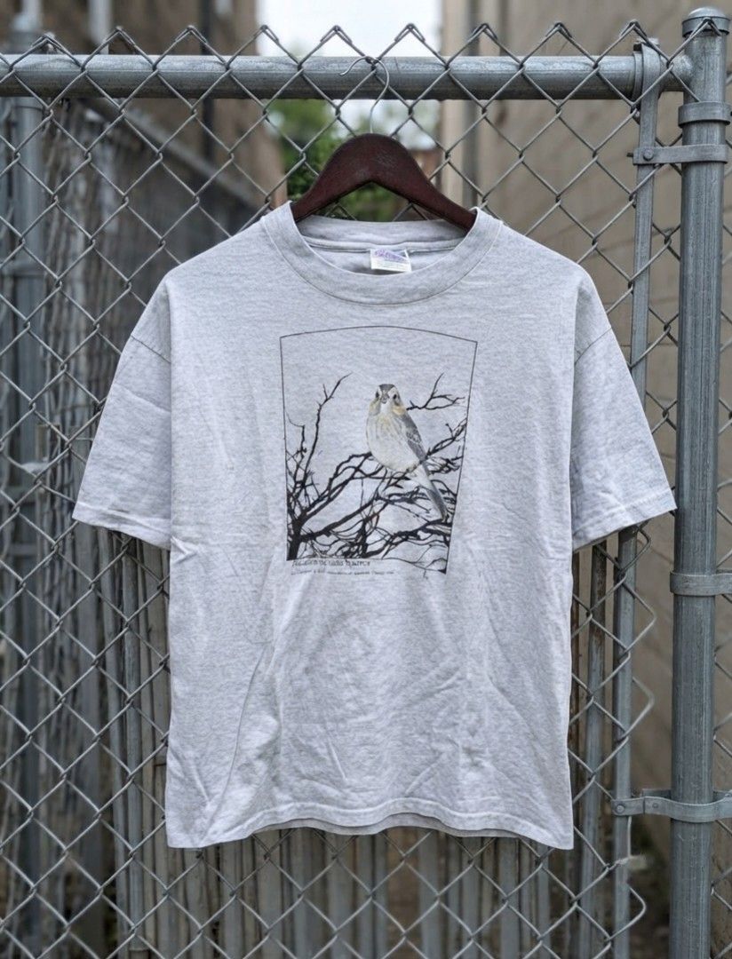 Vintage Acadian Sharp-tail Sparrow Shirt (Category: Tshirts & Polo Shirts ) located in Manila. Submitted by darth3pter (Listing ID 1408563530, Image 1). Description: - Hanes Beefy-T shirt - Features a graphic of an Acadian Sharp-tail Sparrow photograph 1887 by Jonathon Dwight - Color: Light gray - Size: L 21/29 - Material: 99% cotton, 1% other fibers - Graphic: Black and white illustration of the bird on a branch.