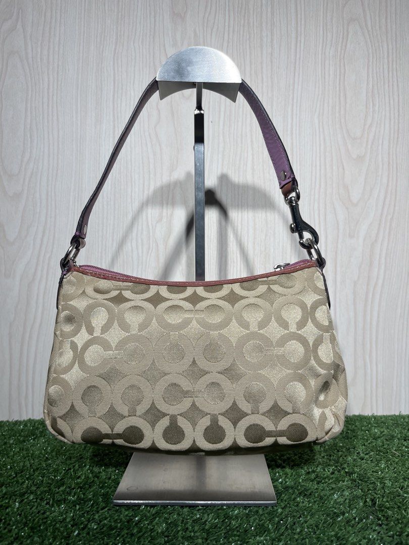 Vintage coach kili bag (Category: Shoulder Bags) located in Bambang. Submitted by uncommon_ph (Listing ID 1449531170, Image 3). Description: This is a vintage Coach Y2K Op Art monogram shoulder bag featuring pink leather trim and the classic horse and carriage logo..