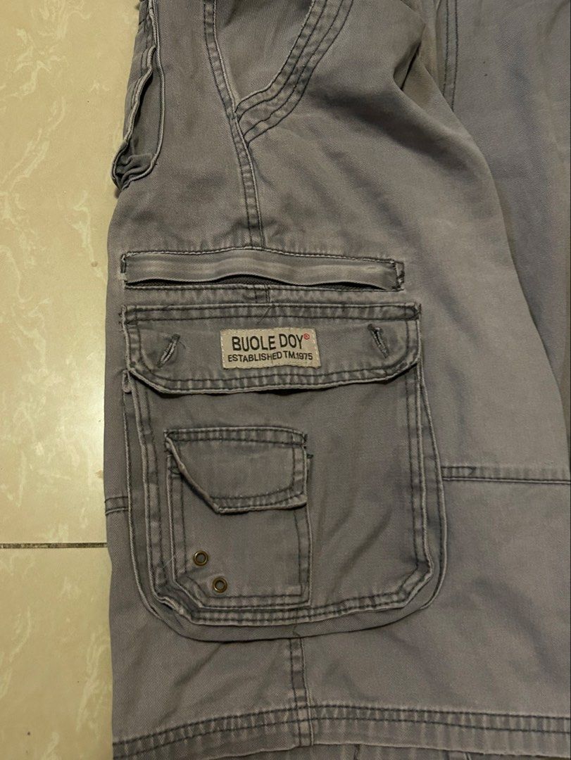 Vintage Grey Cargo Jorts w/ Cool Pockets (Category: Shorts) located in Santa Rosa. Submitted by mandeclutterzzz (Listing ID 1449417266, Image 3). Description: Grey Baggy Vintage Cargo Shorts/Jorts 😍 DIMENSIONS 📏 Length: 22 inches Thigh: 13 inches Leg opening: 12 inches Waist: 32-34 (has drawstrings) small hole in back pocket! tags: vintage, y2k, early 2000’s, alternative, grunge, hip hop, emo, archive, low rise, affliction, 90’s, streetwear, FU