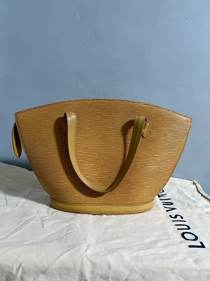 Vintage lv epi saint jacques pm size (Category: Luxury Bags & Wallets) located in Guagua. Submitted by centric_luxe (Listing ID 1449452081, Image 2). Description: This Louis Vuitton Saint Jacques handbag is crafted from yellow Epi leather and features a structured, trapezoidal silhouette. Rank ab With orig dustbag No major flaws Sign of usage only Dm if interested📩.