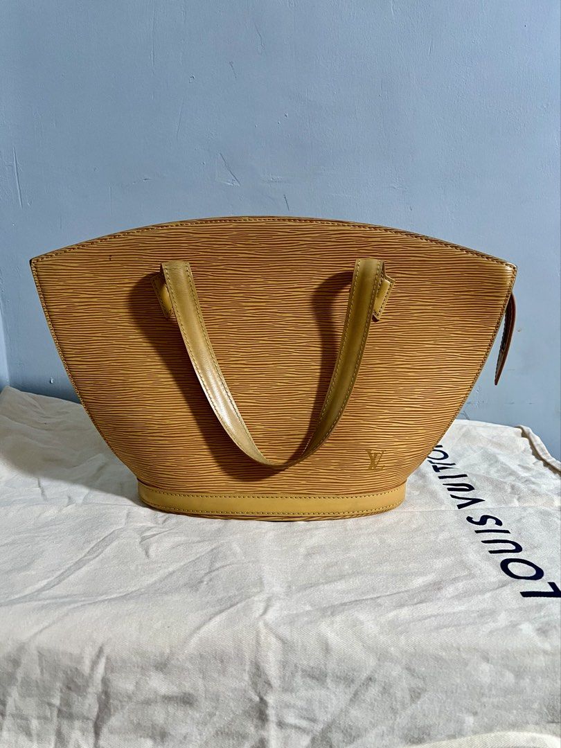 Vintage lv epi saint jacques pm size (Category: Luxury Bags & Wallets) located in Guagua. Submitted by centric_luxe (Listing ID 1449452081, Image 1). Description: This Louis Vuitton Saint Jacques handbag is crafted from yellow Epi leather and features a structured, trapezoidal silhouette. Rank ab With orig dustbag No major flaws Sign of usage only Dm if interested📩.