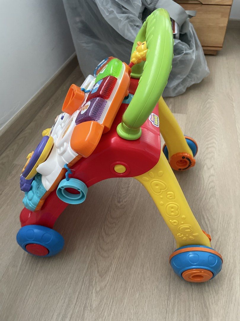 Vtech Walker (Category: Infant Playtime) located in Singapore. Submitted by boldmountain_9e91cc (Listing ID 1449429016, Image 2). Description: - Designed to encourage early walking and play. - Features interactive elements for baby's engagement. - Ready for its next adventure with a new family. Selling because my baby has outgrown it. sell collect from Yishun .