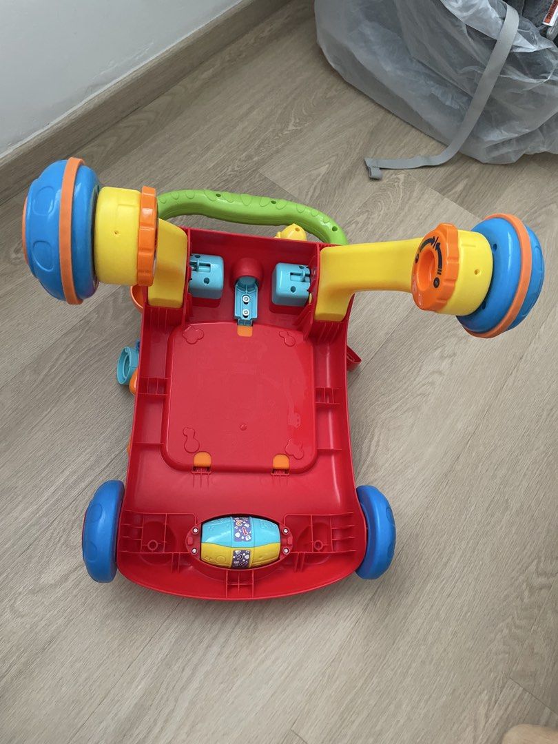 Vtech Walker (Category: Infant Playtime) located in Singapore. Submitted by boldmountain_9e91cc (Listing ID 1449429016, Image 3). Description: - Designed to encourage early walking and play. - Features interactive elements for baby's engagement. - Ready for its next adventure with a new family. Selling because my baby has outgrown it. sell collect from Yishun .