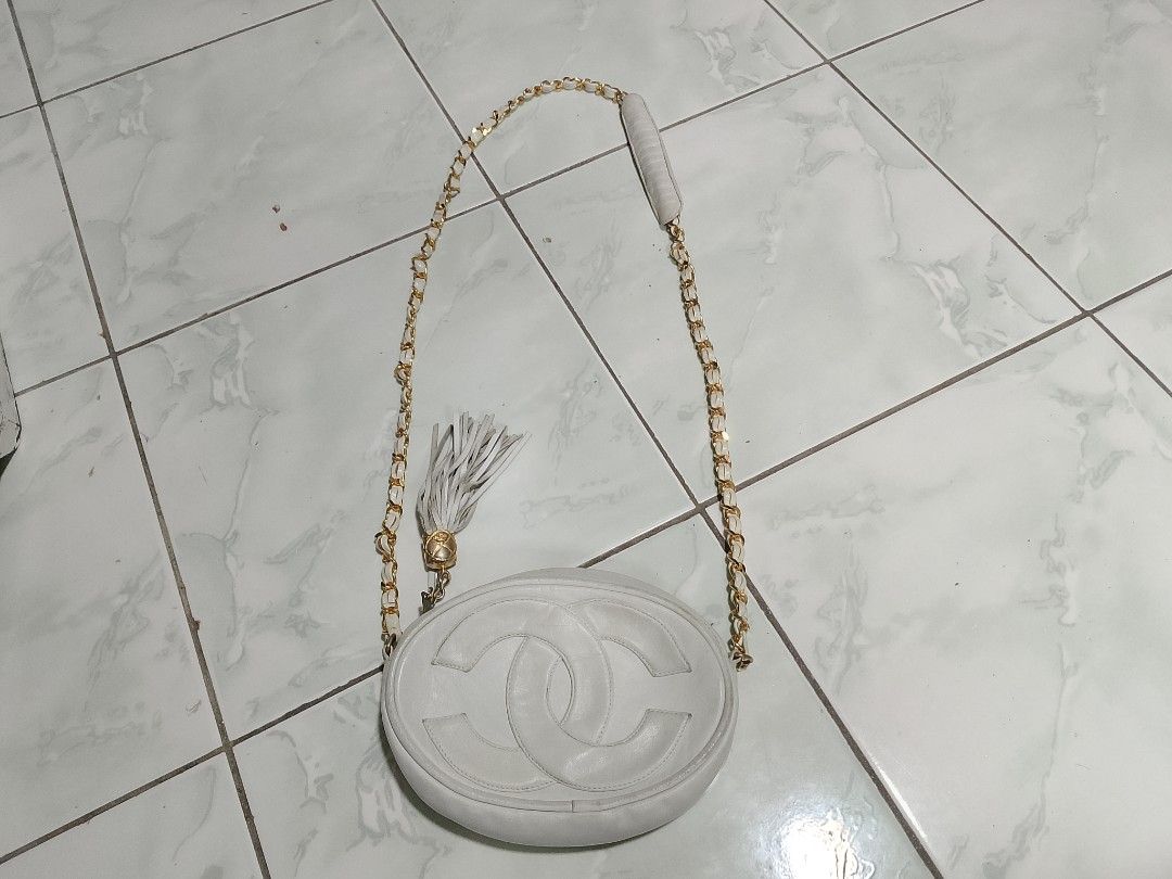 White Chanel CC Tassel Shoulder Bag (Category: Luxury Bags & Wallets) located in Manila. Submitted by sheshe.888 (Listing ID 1449413647, Image 1). Description: - White leather shoulder bag - Gold chain strap - Iconic CC logo detail - Tassel accent - Secure zipper closure - Interior zip pocket - Ideal for carrying your essentials - preloved.