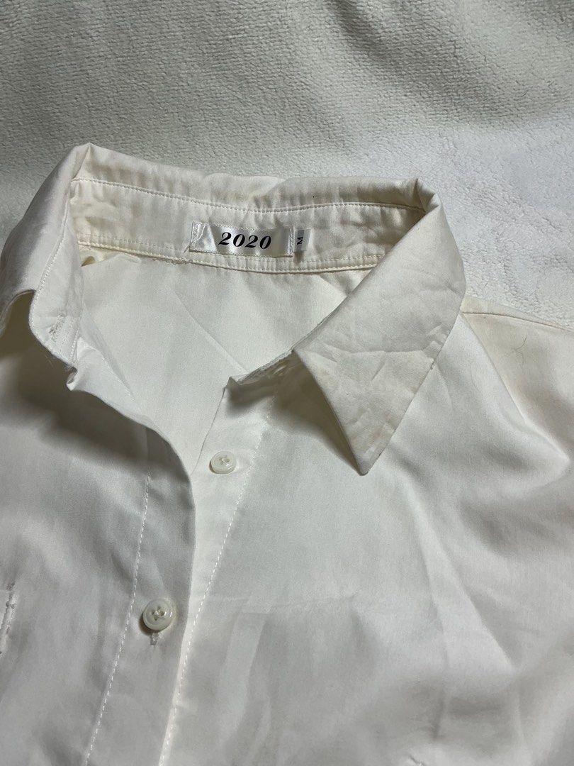 White Cropped Long Sleeve Button Up Shirt (Category: Longsleeves) located in Makati City. Submitted by studentista (Listing ID 1449511427, Image 3). Description: - White cropped shirt - Long sleeves - Button-up front - Single chest pocket (left side) - Estimated Size: S - Versatile: Great for layering or wearing on its own.