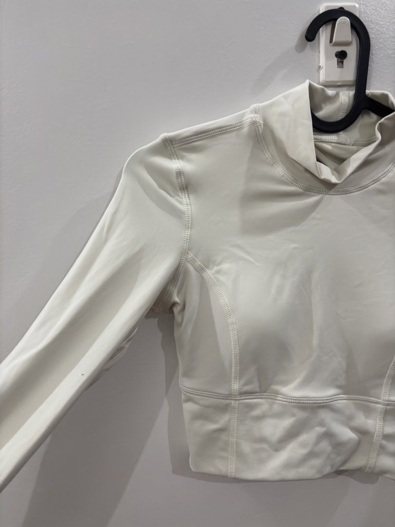 White Mock Neck Long Sleeve Cutout Crop Top (Category: Longsleeves) located in Agdangan. Submitted by mics01 (Listing ID 1449425231, Image 3). Description: - White long sleeve crop top - Mock neck design - Chic back cutout detail - Stretchy and comfortable material - Cropped length, hits at the waist - Ideal for workouts .