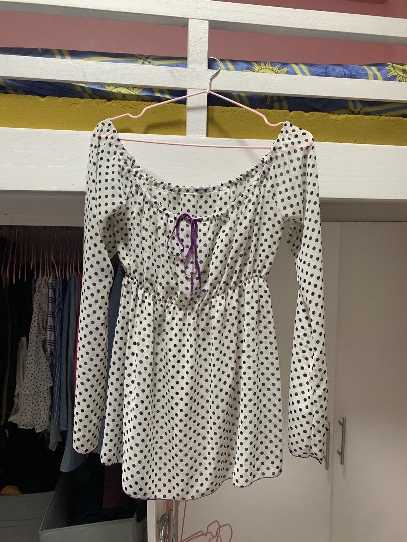 White Polka Dot Off-Shoulder Long Sleeve Blouse (Category: Blouses) located in Manila. Submitted by officialysaw (Listing ID 1449414925, Image 1). Description: - White blouse with black polka dots - Off-shoulder neckline with purple ribbon tie - Long sleeves with elasticated cuffs - Elasticated hemline - Perfect for casual or dressy occasions - Easily pairs with jeans or skirts.