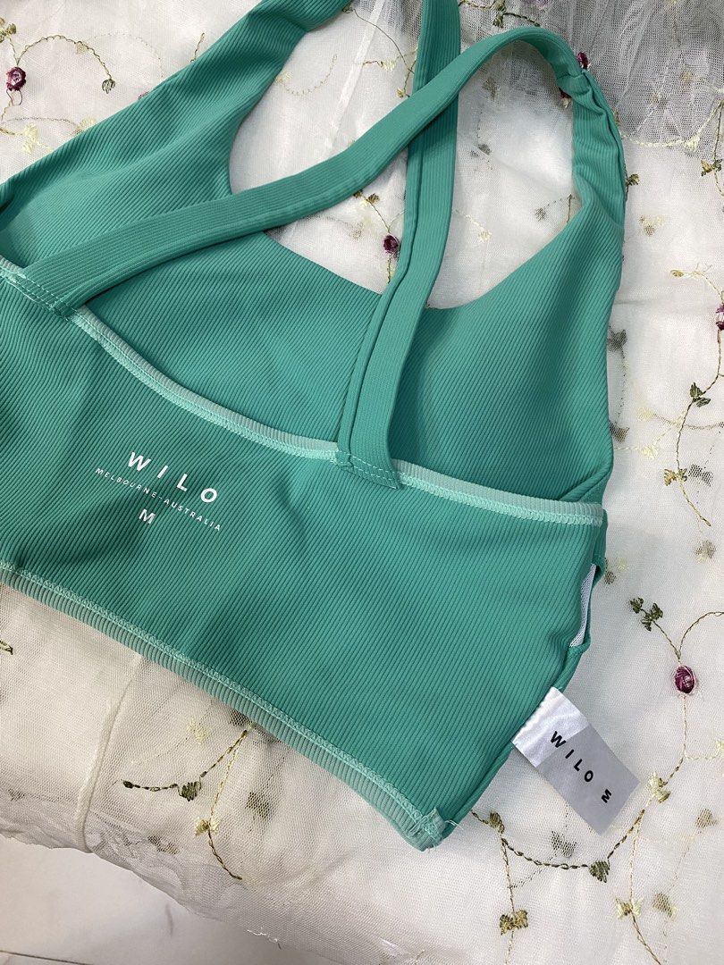 WILO Activewear (Category: Activewear) located in Taytay. Submitted by cami0110 (Listing ID 1449478708, Image 3). Description: - Teal ribbed sports bra from WILO Active - Features a stylish criss-cross back design - Supportive underbust band for a secure fit - Made from a comfortable nylon and spandex blend - Versatile for workouts or everyday casual wear.