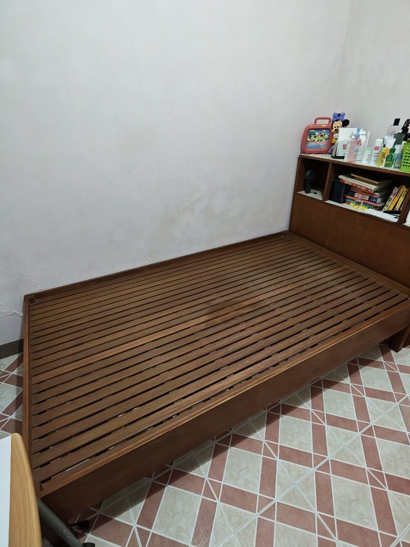 Wooden Bed Frame with Headboard Shelves (Category: Bed Frames & Mattresses) located in Santa Rosa. Submitted by deeee.clutter (Listing ID 1449453309, Image 1). Description: - Solid wood bed frame -Custom size: 42" x 75" - Built-in headboard with shelves for storage (perfect for books/decor) - Slat base for mattress support - Natural wood finish - Sturdy construction - Ready for a new home #bedframe #bed #singlebed.