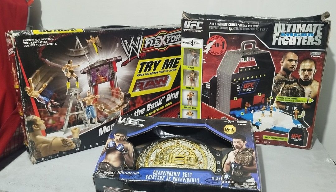 WWE FlexForce Ring & UFC Ultimate Fighters Playset (Category: Action & Battle Toys) located in Baguio. Submitted by highland_finds (Listing ID 1449441516, Image 1). Description: FS: WWE Flex force money in the bank Ring New Complete Sealed accessories Tested/working Issue: box P5k UFC Ultimate Fighters micro New Complete Sealed accessories Issue: box P5k WEC championship belt New Issue: box P1.5k Set: P9k Just DM📩 for more info..