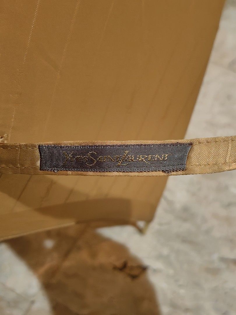 Ysl gold umbrella (Category: Umbrellas) located in Calamba. Submitted by princesspauliney. (Listing ID 1449490587, Image 3). Description: YSL GOLD UMBRELLA No tarnish on all the metal💯 Malinis💯 Maganda💯 Legit kahit sa mismong tela may YSL. 💯 Brand new may plastic pa 💯 1150 only.