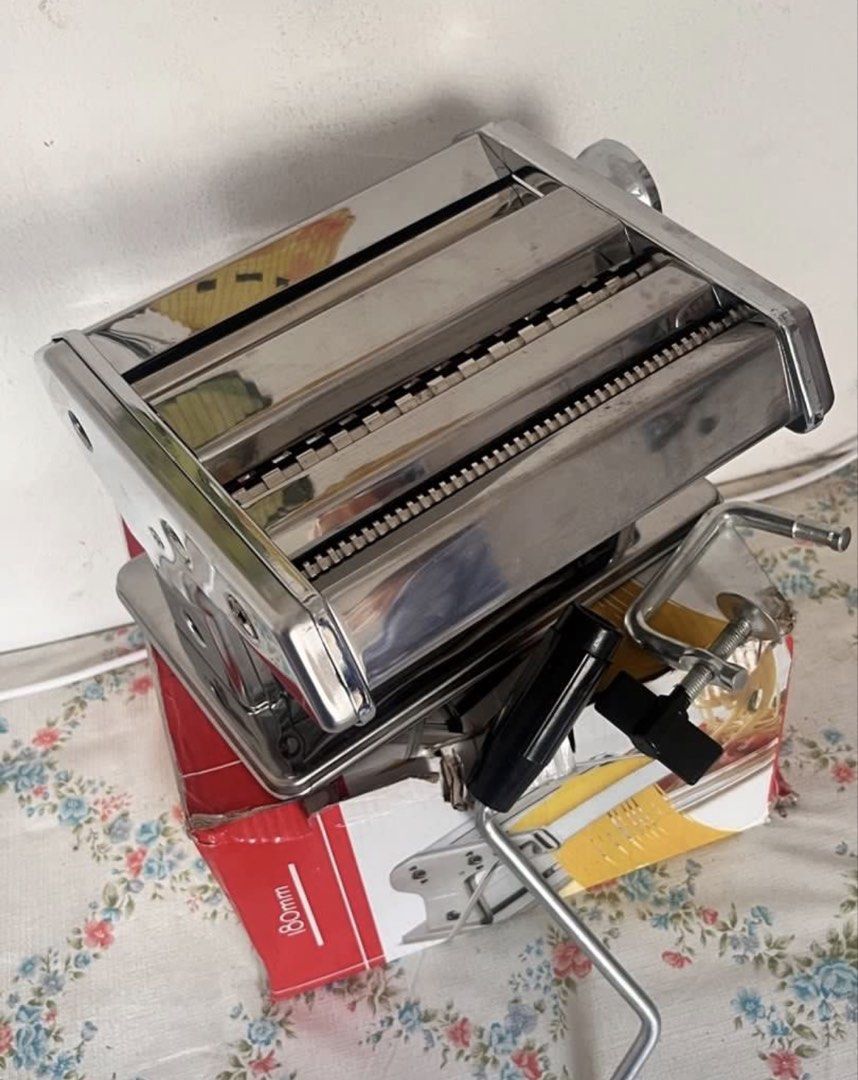 180mm Stainless Steel Manual Pasta Maker Machine (Category: Other Kitchen Appliances) located in Cavite. Submitted by _deeeeeeeeeng (Listing ID 1449659077, Image 2). Description: - Make fresh pasta at home with this durable stainless steel maker. - Includes a clamp to securely attach it to your countertop. - 180mm wide, ideal for various pasta shapes. - Perfect for homemade noodles and lasagna sheets..
