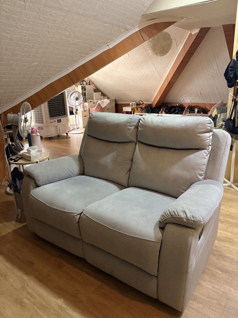2-Seater Recliner Sofa - Light Grey Fabric (Category: Sofas) located in Paranaque City. Submitted by aihp20 (Listing ID 1449680322, Image 3). Description: - Comfortable 2-seater recliner sofa - Upholstered in soft, light grey fabric - Both sides recline for ultimate relaxation - Ideal for living rooms or home theaters - Easy-to-use recliner levers - Ample cushioning for great support - Perfect for lounging and unwinding.