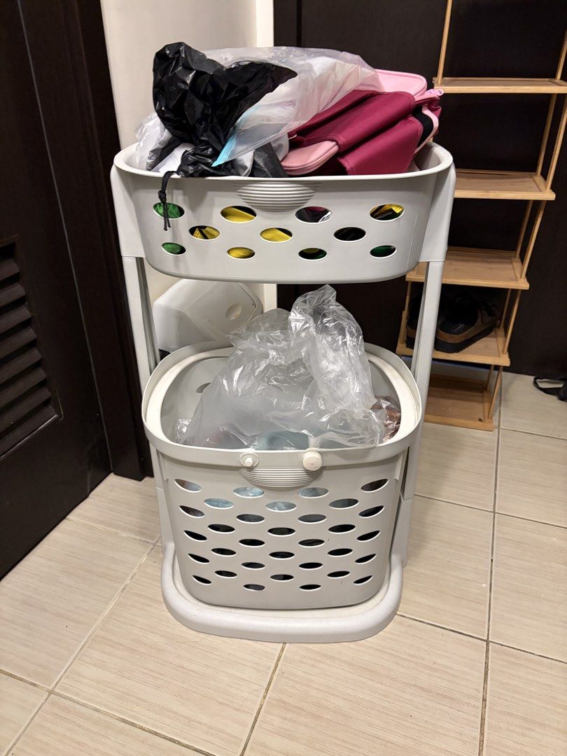 2-Tier White Laundry Basket with Wheels (Category: Laundry Baskets) located in Paranaque City. Submitted by lexbunny (Listing ID 1449582666, Image 1). Description: - White 2-tier laundry basket - Features wheels for easy mobility - Top basket is removable - Ideal for organizing laundry or other items - Space-saving design, perfect for small areas Things inside not included.