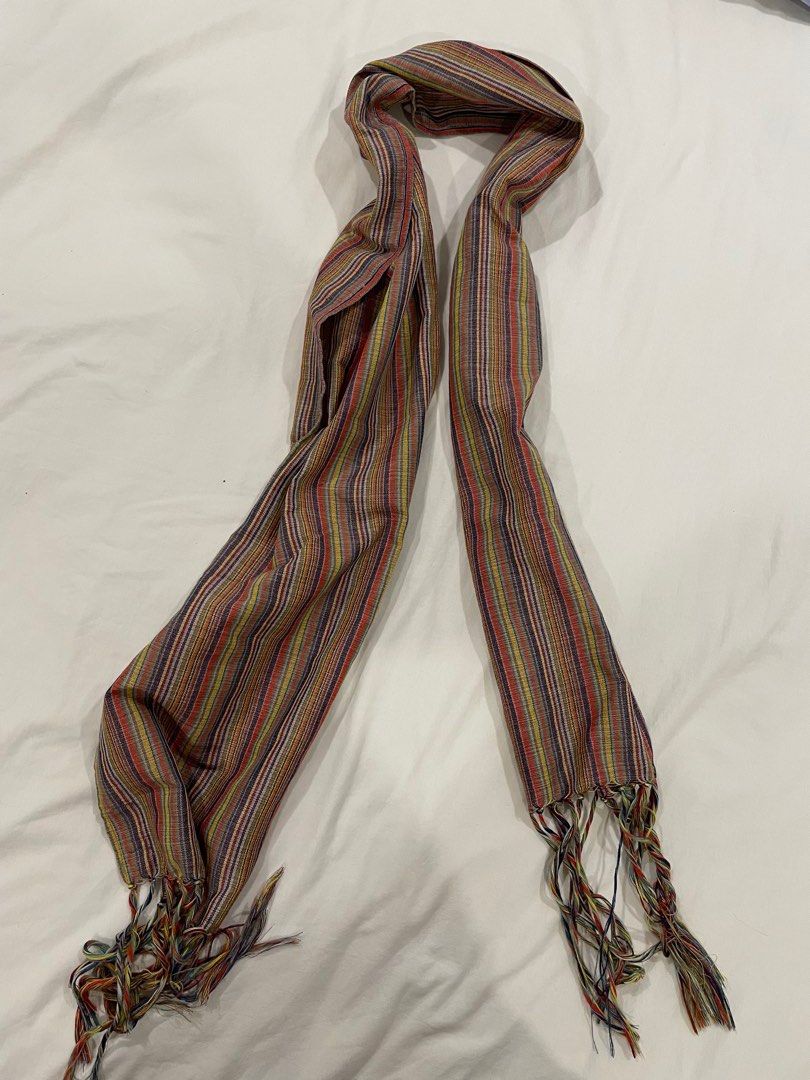 Anthill Woven Scarf (Category: Scarves) located in Makati City. Submitted by randombloggingstuff (Listing ID 1445648504, Image 1). Description: - Handwoven scarf by Anthill - Features a vibrant, colorful striped pattern - Tassels on both ends for added detail - Proudly Made in the Philippines - 64 inches length x 10 inches wide - Adds a stylish pop of color to any outfit.
