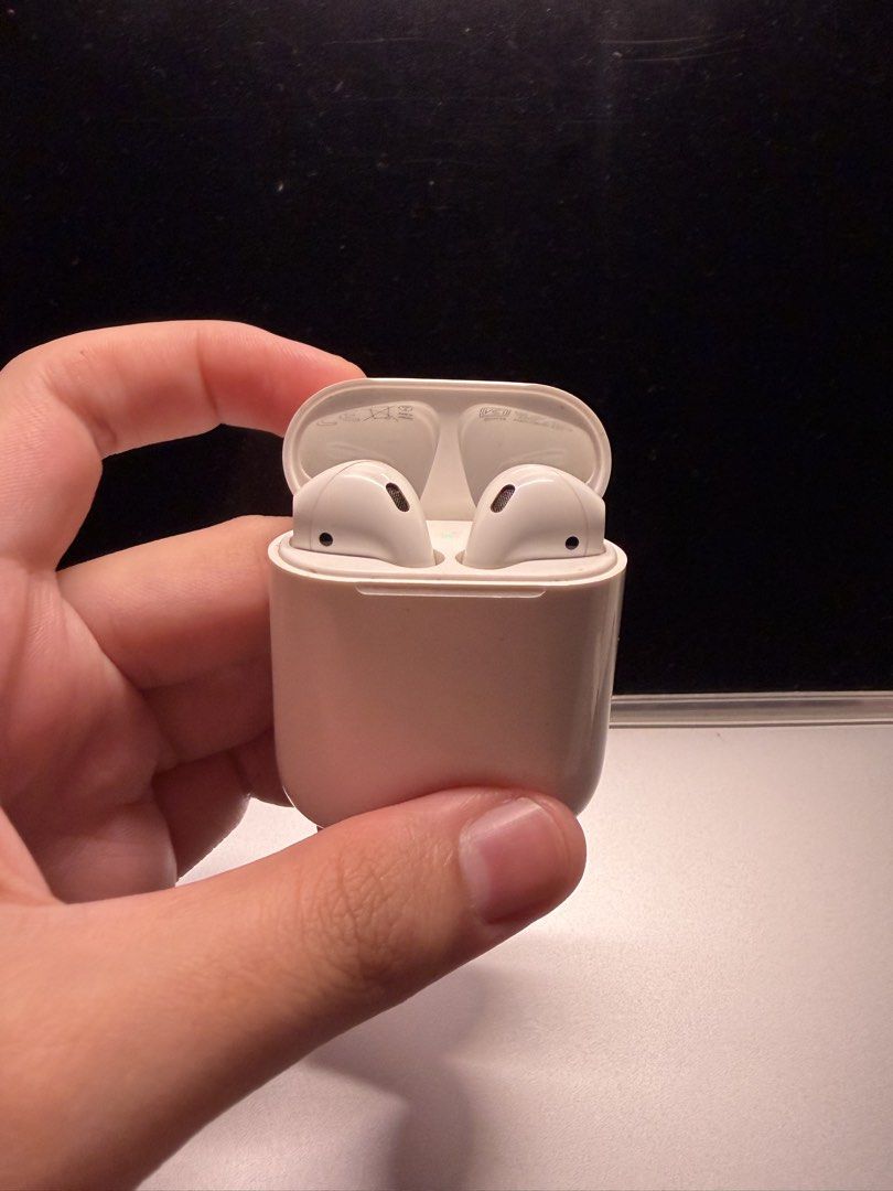 Apple AirPods 2nd Gen (Category: Earphones) located in Dasmarinas. Submitted by authenticlady (Listing ID 1449666168, Image 2). Description: - Personally used airpods I bought in 2023 - Both are still functioning well kaso max 30mins lang magagamit kasi mabilis na malowbatt - No scratches or external damages - Onigiri case included .