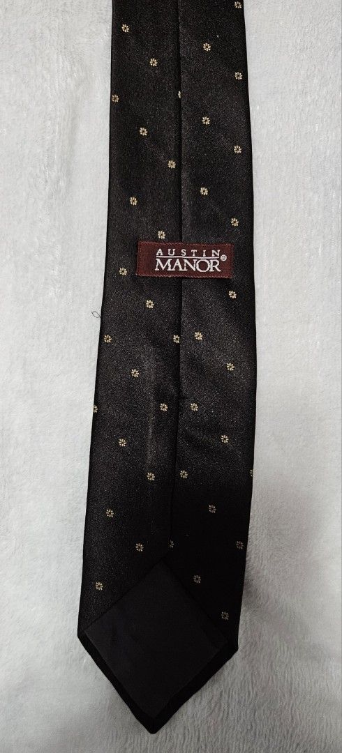 Austin Manor Dark Brown Polka Dot Silk Tie (Category: Ties) located in Caloocan City. Submitted by rm.diaz (Listing ID 1449660472, Image 2). Description: - Austin Manor Dark brown tie - Features small gold polka dots - Ideal for formal events or elevating an outfit.