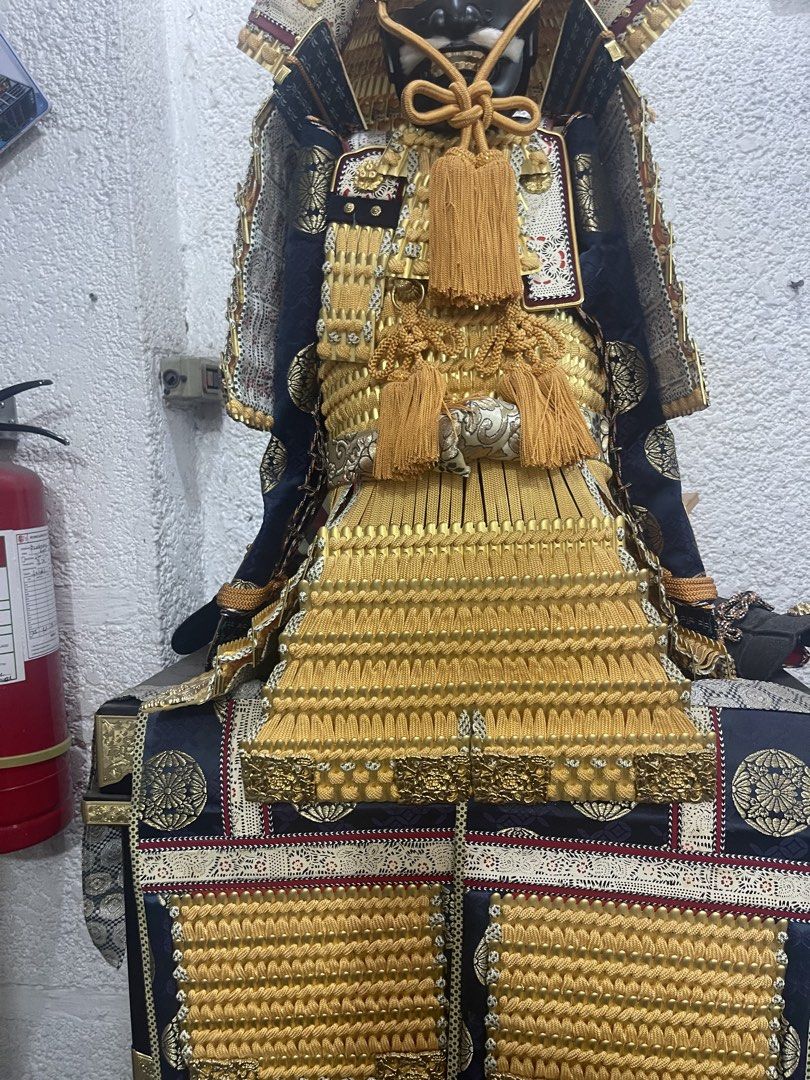 Authentic Japanese Samurai Armor Display (Category: Vintage Collectibles) located in Manila. Submitted by chesterson1979. (Listing ID 1449540680, Image 3). Description: - Full samurai armor set - Intricate gold and black detailing - Comes with decorative chest and small shoes - Ideal for collectors or unique home decor - Ready for display.