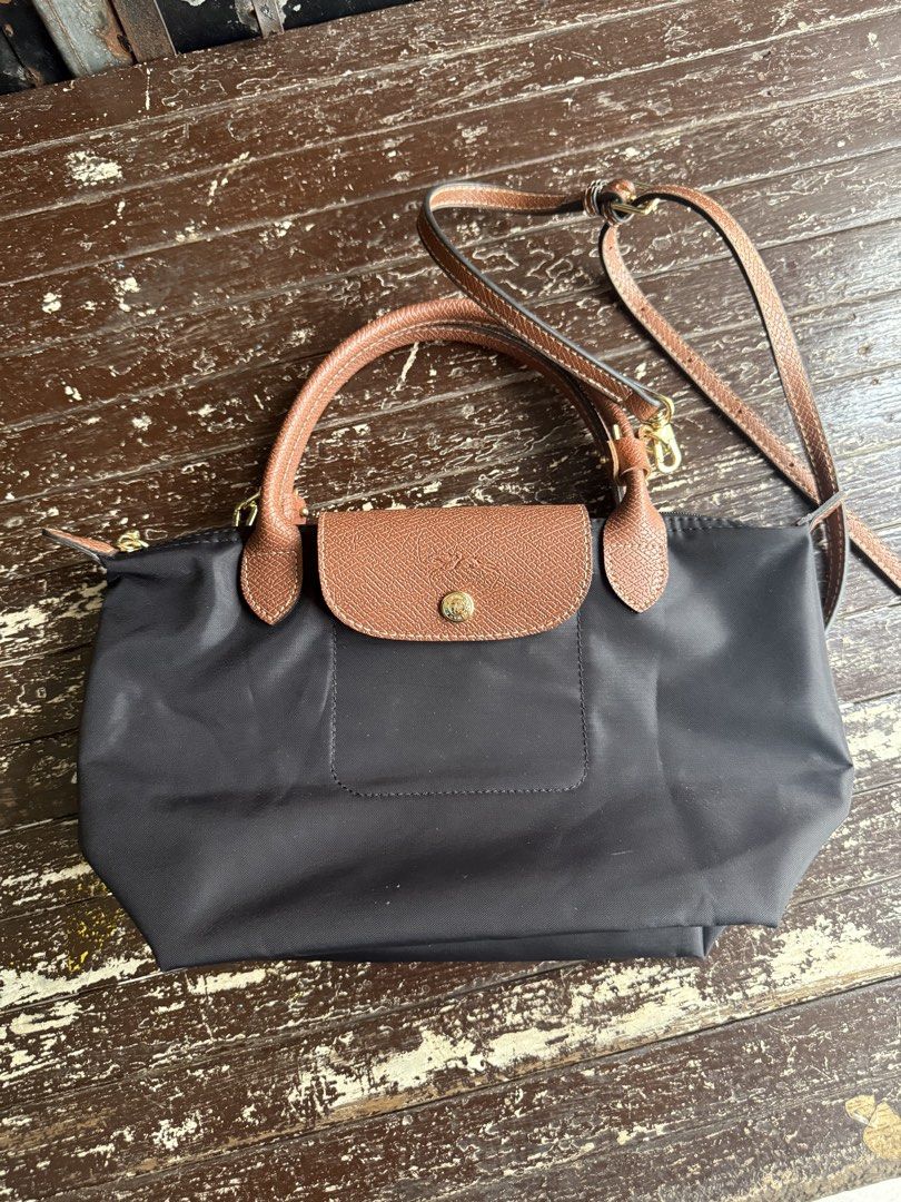 Authentic Longchamp Le Pliage Neo Bag - Black and Gray (Category: Luxury Bags & Wallets) located in Caloocan City. Submitted by threegirlscloset2 (Listing ID 1449680047, Image 1). Description: Authentic Hindi nagamit; natambak lang siya Two colors available: Black and Gray - SOLD❌ Negotiable - please send your offer badly needed to dispose these two bag. .
