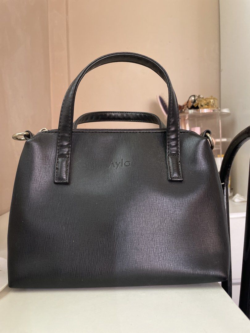 Ayla Black Leather Handbag (Category: Luxury Bags & Wallets) located in Baao. Submitted by closetbykb (Listing ID 1449556837, Image 1). Description: - Brand: Ayla - Material: Black Leather - Features: Top handles, detachable shoulder strap - Design: Simple and classic - Interior: Spacious and clean - Use: Ideal for daily wear, versatile for any outfit.