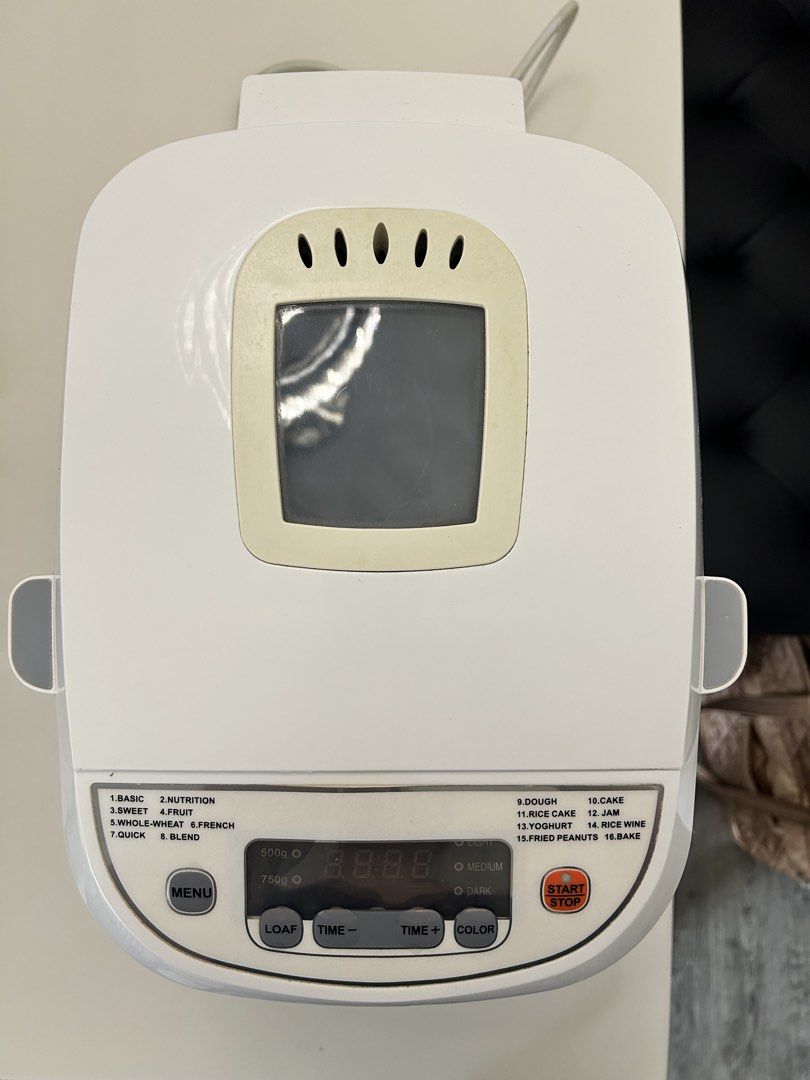 Aztech Bread Maker (Category: Breadmakers) located in Singapore. Submitted by kiwijam (Listing ID 1449660160, Image 3). Description: - White Aztech bread maker - Multiple settings for different bread types and doughs - Includes measuring cups and paddle - Perfect for homemade bread - Easy-to-use controls.