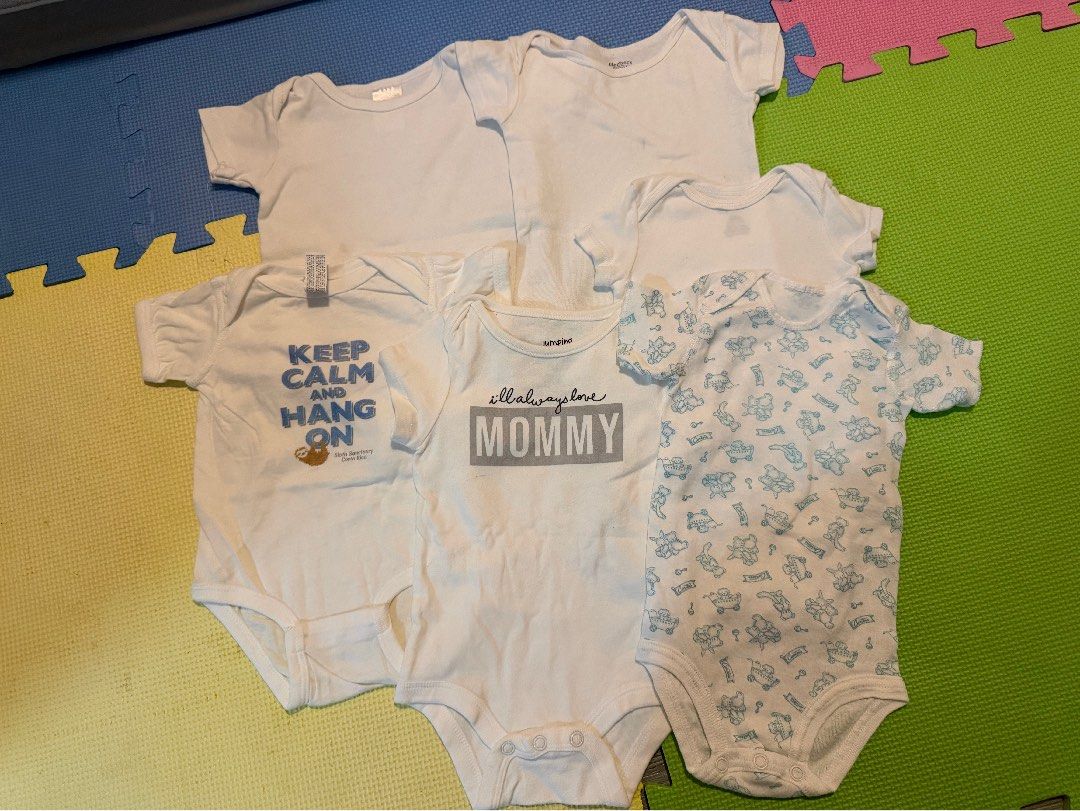 Baby Onesies Bundle - Various Designs and Plain White (Category: Babies & Kids Fashion) located in Carmona. Submitted by reyamee (Listing ID 1449740632, Image 2). Description: Bundle of 6 baby onesies. Includes plain white onesies and onesies with fun prints. One has 'Keep Calm and Hang On' with a sloth. Another says 'I'll always love MOMMY'. The patterned one has cute blue animal figures. Great for everyday wear. Mix and match for your little on