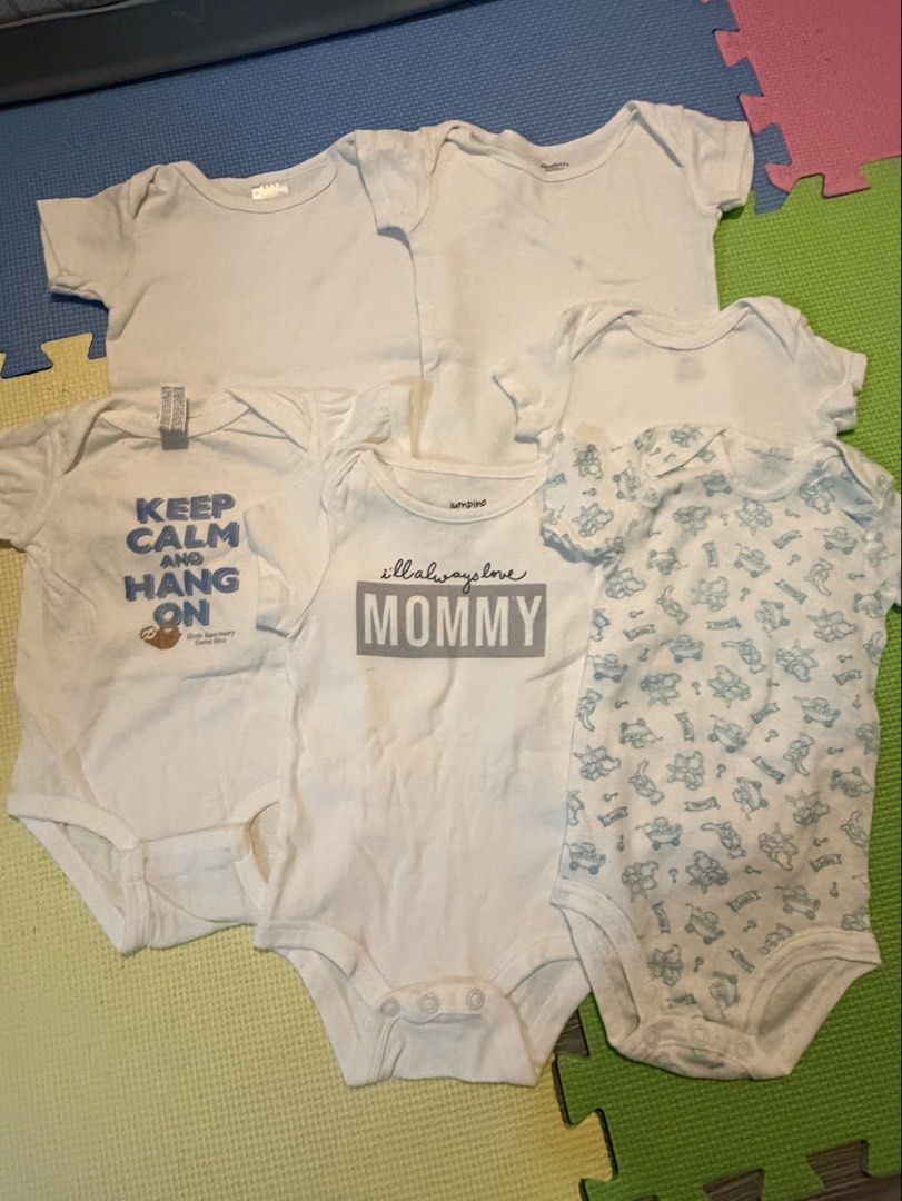 Baby Onesies Bundle - Various Designs and Plain White (Category: Babies & Kids Fashion) located in Carmona. Submitted by reyamee (Listing ID 1449740632, Image 1). Description: Bundle of 6 baby onesies. Includes plain white onesies and onesies with fun prints. One has 'Keep Calm and Hang On' with a sloth. Another says 'I'll always love MOMMY'. The patterned one has cute blue animal figures. Great for everyday wear. Mix and match for your little on