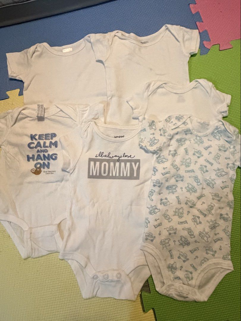 Baby Onesies Bundle - Various Designs and Plain White (Category: Babies & Kids Fashion) located in Carmona. Submitted by reyamee (Listing ID 1449740632, Image 3). Description: Bundle of 6 baby onesies. Includes plain white onesies and onesies with fun prints. One has 'Keep Calm and Hang On' with a sloth. Another says 'I'll always love MOMMY'. The patterned one has cute blue animal figures. Great for everyday wear. Mix and match for your little on
