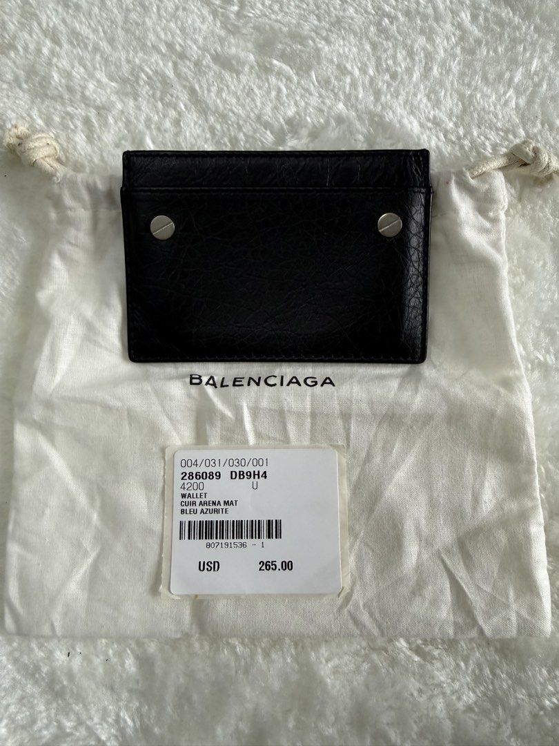 Balenciaga Black Leather Card Holder (Category: Luxury Bags & Wallets) located in Cavite. Submitted by gabrielmontalban (Listing ID 1449633439, Image 1). Description: - Authentic Balenciaga card holder - Color: Black - Material: Leather - Features multiple card slots - Comes with original dust bag - Includes authenticity card - Minimalist and perfect for everyday use.