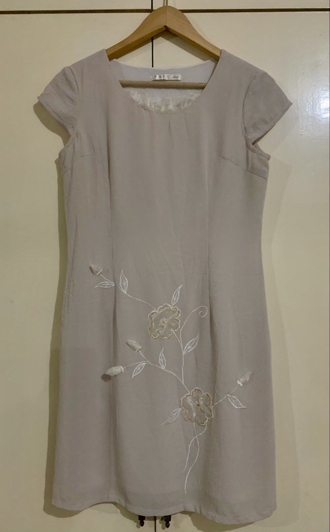 Beige Embroidered Cap Sleeve Dress (Category: Dresses) located in Paranaque City. Submitted by vbvessentials (Listing ID 1449703030, Image 1). Description: - Beige dress - Delicate floral embroidery - Cap sleeves - Round neckline with sheer ruffled trim - Approximate measurements: Chest 17", Length 36" XL on tag but fits medium frame.