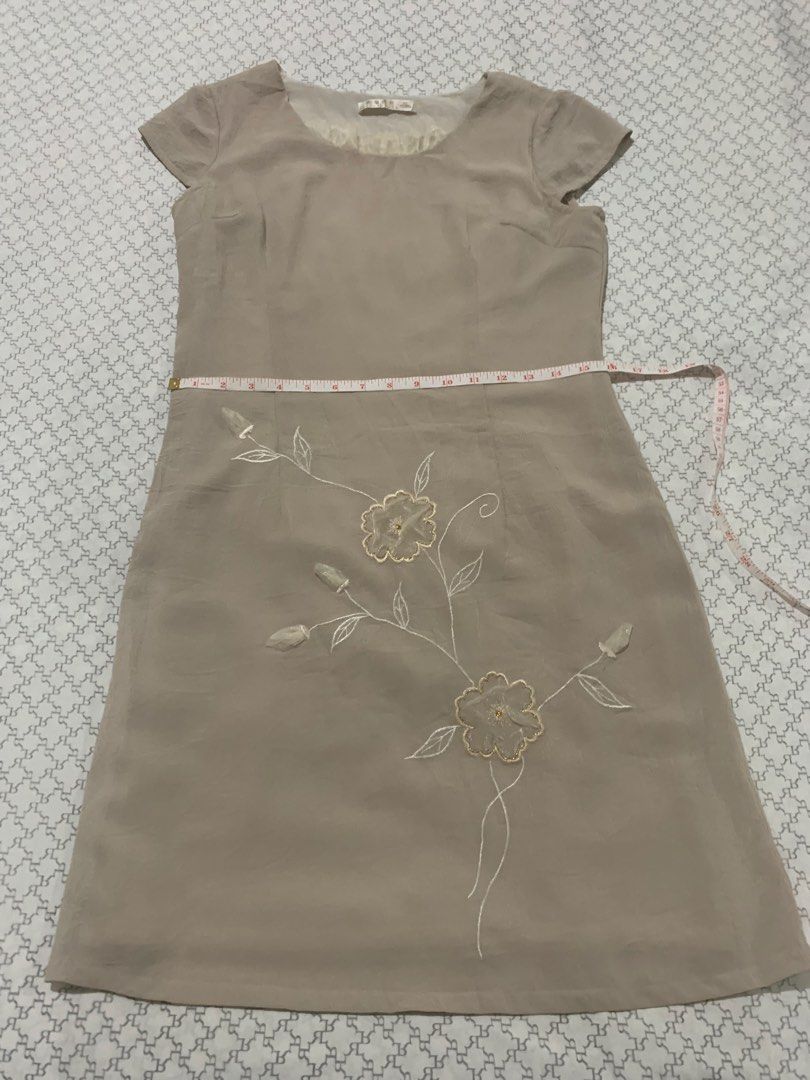 Beige Embroidered Cap Sleeve Dress (Category: Dresses) located in Paranaque City. Submitted by vbvessentials (Listing ID 1449703030, Image 2). Description: - Beige dress - Delicate floral embroidery - Cap sleeves - Round neckline with sheer ruffled trim - Approximate measurements: Chest 17", Length 36" XL on tag but fits medium frame.