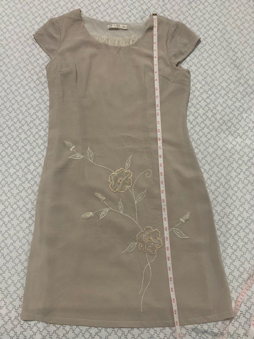 Beige Embroidered Cap Sleeve Dress (Category: Dresses) located in Paranaque City. Submitted by vbvessentials (Listing ID 1449703030, Image 3). Description: - Beige dress - Delicate floral embroidery - Cap sleeves - Round neckline with sheer ruffled trim - Approximate measurements: Chest 17", Length 36" XL on tag but fits medium frame.