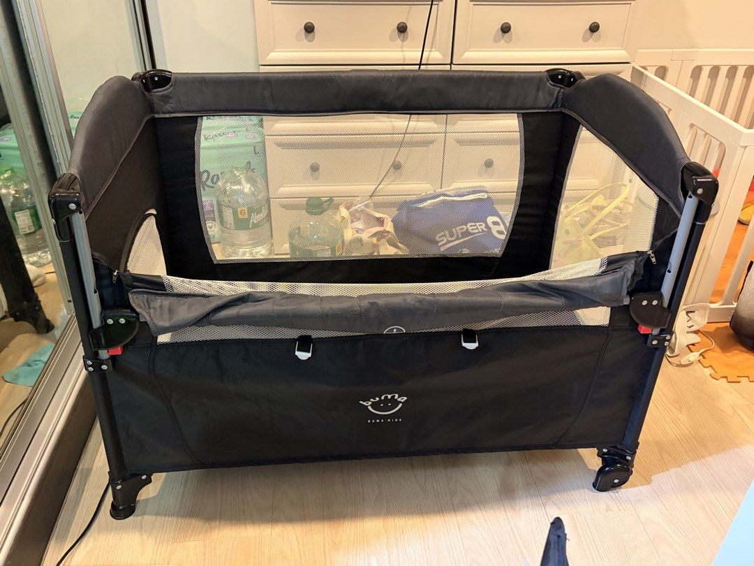 Black Foldable Travel Crib with Wheels (Category: Cots & Cribs) located in Pasig City. Submitted by mommysellerbgc (Listing ID 1449646905, Image 2). Description: Foldable crib with free gifts: - Board - Storage bag - Bed bell toy - Diaper table changer - Mosquito net - Rocker.