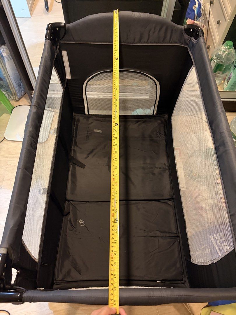 Black Foldable Travel Crib with Wheels (Category: Cots & Cribs) located in Pasig City. Submitted by mommysellerbgc (Listing ID 1449646905, Image 3). Description: Foldable crib with free gifts: - Board - Storage bag - Bed bell toy - Diaper table changer - Mosquito net - Rocker.