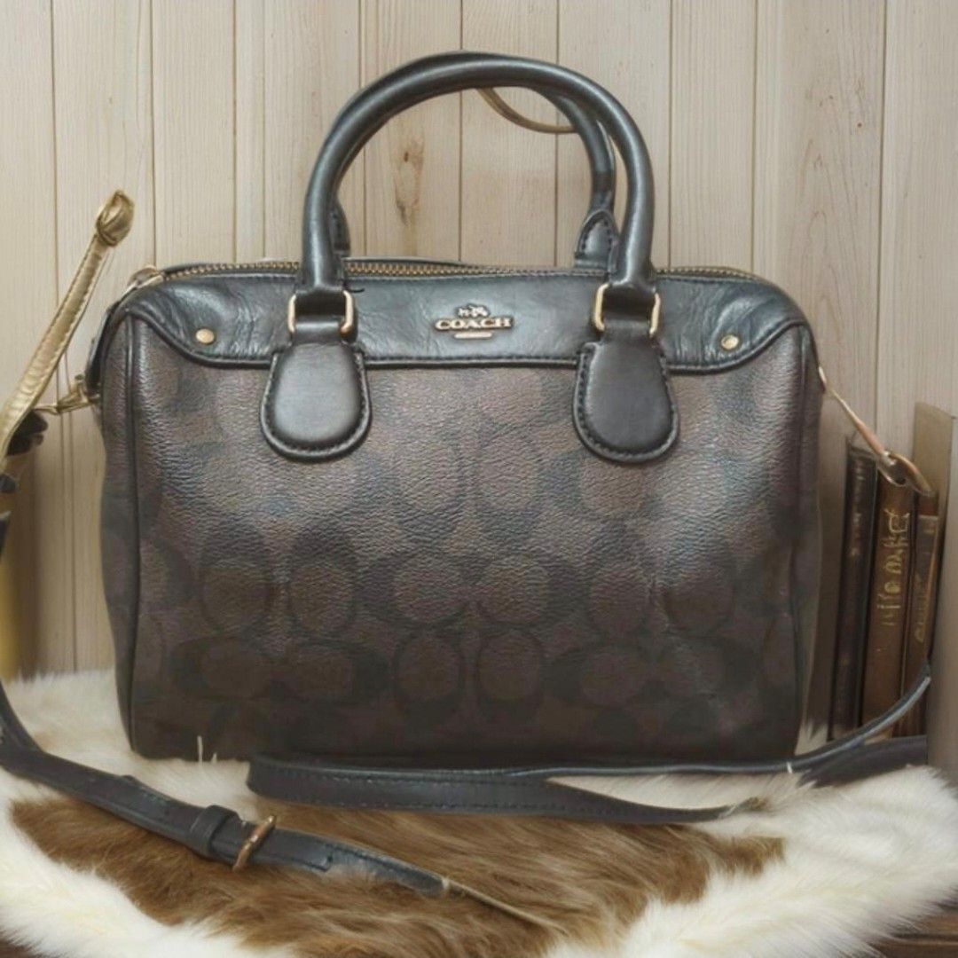 Coach Bennet (Category: Luxury Bags & Wallets) located in San Juan City. Submitted by bellarina05 (Listing ID 1449748566, Image 1). Description: • Material: Signature coated canvas with fabric lining • Measurements: 10” (L) x 6.5” (H) x 5.5” (W) • Handle Drop: 4.25” • Strap: Detachable with 23” drop for shoulder or crossbody wear • Features: Outside zip pocket, inside zip & multifunction pockets, zip closure..