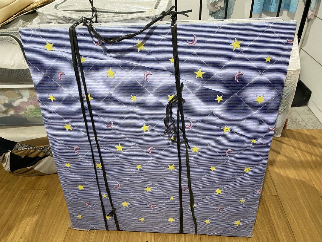 Blue Star and Moon Print Mattress (Category: Bed Frames & Mattresses) located in Manila. Submitted by gelle.02 (Listing ID 1443102890, Image 1). Description: - Blue mattress with a cute star and moon pattern. - Ideal for a child's bedroom or as a guest bed. - Used for 4 months only. Visible small tear on the sides due to transfer. - Extra photos will be sent as per request. - No box included (can be picked up by buyer/ through a lalamove car book
