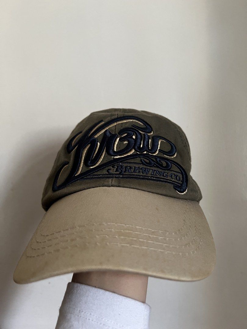 Brewing Co. Baseball Cap (Category: Caps & Hats) located in Manila. Submitted by aicalicious (Listing ID 1449632779, Image 1). Description: - Olive green and tan baseball cap - Navy blue 'Brew' embroidery with 'Brewing Co.' underneath - '27' embroidered on the side Can do meet up or Lalamove .
