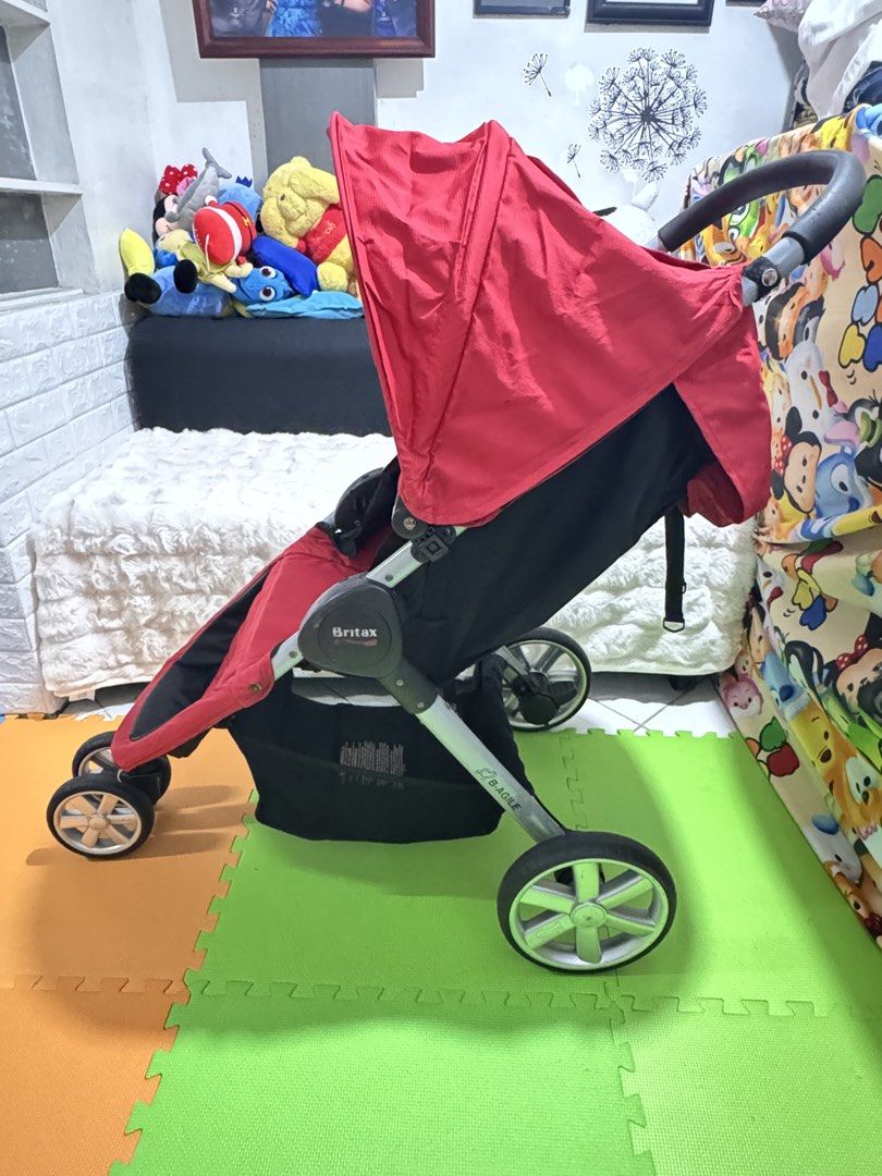 Britax B-Agile Stroller - Red (Category: Strollers) located in Mandaluyong City. Submitted by handed.down.shop (Listing ID 1449538766, Image 2). Description: - Britax B-Agile stroller - Color: Red - Condition: Good, with minor signs of wear - Professionally cleaned and ready to use - Price: P4500 - Message for detailed photos.