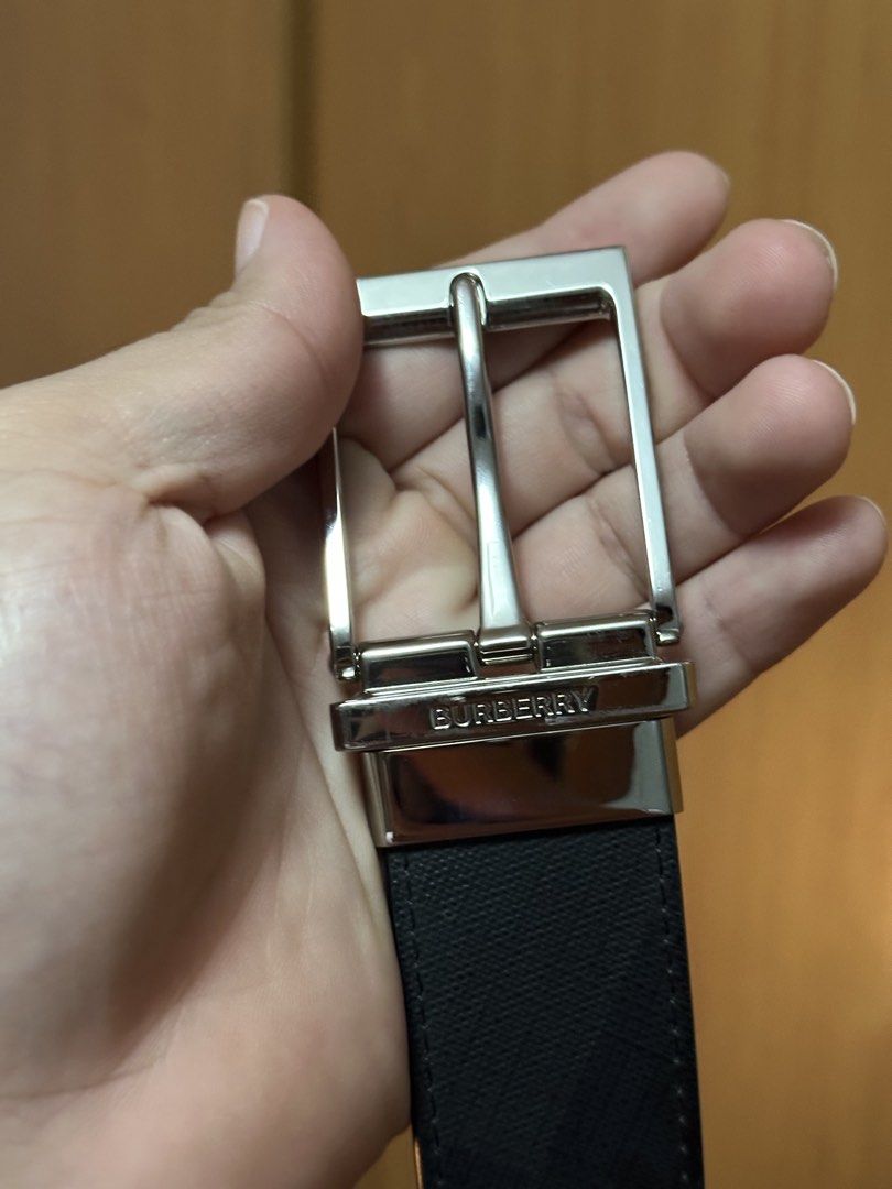 Burberry Reversible Belt with Silver Buckle (Category: Belts) located in Manila. Submitted by frzy009 (Listing ID 1449726420, Image 3). Description: - Authentic Burberry Belt - Reversible: Black on one side - Silver buckle with iconic Burberry logo - Made in Italy - Size: 44 / 110 - Complete Full Set — comes with the original Burberry box, dust bag, and product cards/paperwork as shown in the photos. - Hardware: Polished Silver-Tone Buckle (engra