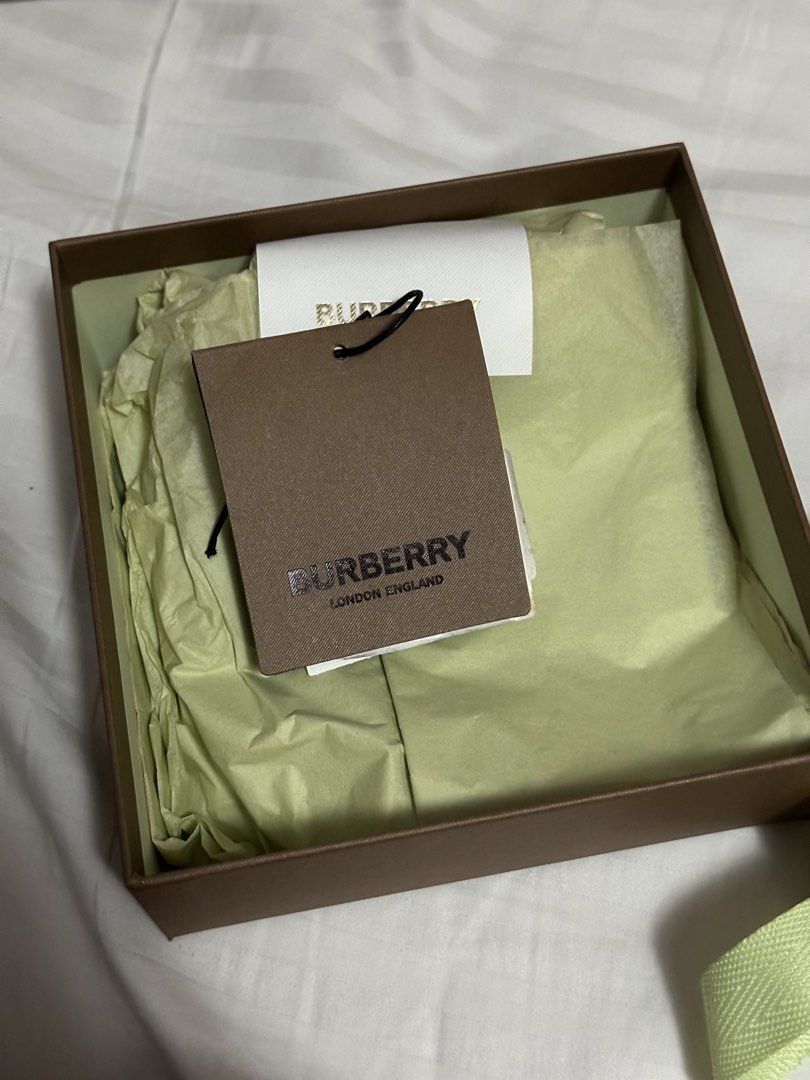 Burberry Reversible Belt with Silver Buckle (Category: Belts) located in Manila. Submitted by frzy009 (Listing ID 1449726420, Image 2). Description: - Authentic Burberry Belt - Reversible: Black on one side - Silver buckle with iconic Burberry logo - Made in Italy - Size: 44 / 110 - Complete Full Set — comes with the original Burberry box, dust bag, and product cards/paperwork as shown in the photos. - Hardware: Polished Silver-Tone Buckle (engra