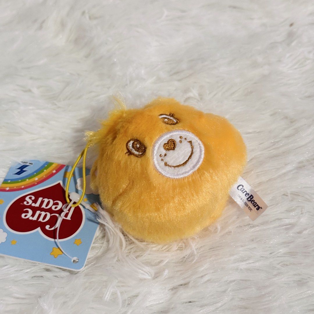 Care Bears Funshine Bear Plush Charm Keychain (Category: Plushies & Soft Toys) located in Caloocan City. Submitted by raeccas.selections (Listing ID 1449558904, Image 2). Description: Bnew with paper tag! Pwede din daw hair tie 💛 RFS: downsizing collection Location: North caloocan Courier: J&T or Lalamove Payment: Gcash or bank transfer.