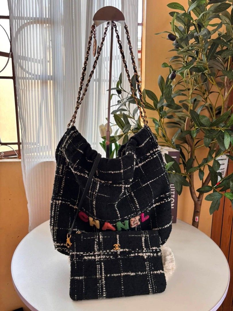 Chanel Quilted Wool Tweed 22 Tote Bag (Category: Luxury Bags & Wallets) located in Bayombong. Submitted by Gentlemans_ClosEt (Listing ID 1449691306, Image 1). Description: Chanel Black, White, and Rainbow Quilted Wool Tweed 22 Tote Aged Gold Hardware, Rank A Very nice in actual Self Authentication No issue Source: Japan surplus.