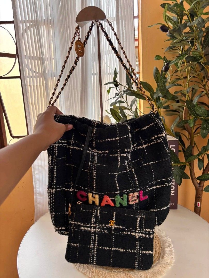 Chanel Quilted Wool Tweed 22 Tote Bag (Category: Luxury Bags & Wallets) located in Bayombong. Submitted by Gentlemans_ClosEt (Listing ID 1449691306, Image 2). Description: Chanel Black, White, and Rainbow Quilted Wool Tweed 22 Tote Aged Gold Hardware, Rank A Very nice in actual Self Authentication No issue Source: Japan surplus.