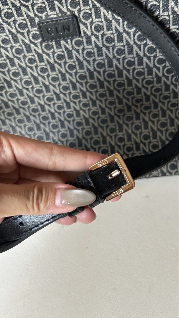 CLN Monogram Crossbody Bag with Dust Bag (Category: Cross-body Bags) located in Makati City. Submitted by carrillopr37736 (Listing ID 1449621906, Image 2). Description: - CLN Monogram Crossbody Bag - Classic black and white all-over pattern - Adjustable strap with buckle detail - Interior features a patterned lining - Comes with original dust bag - Ideal for everyday wear.