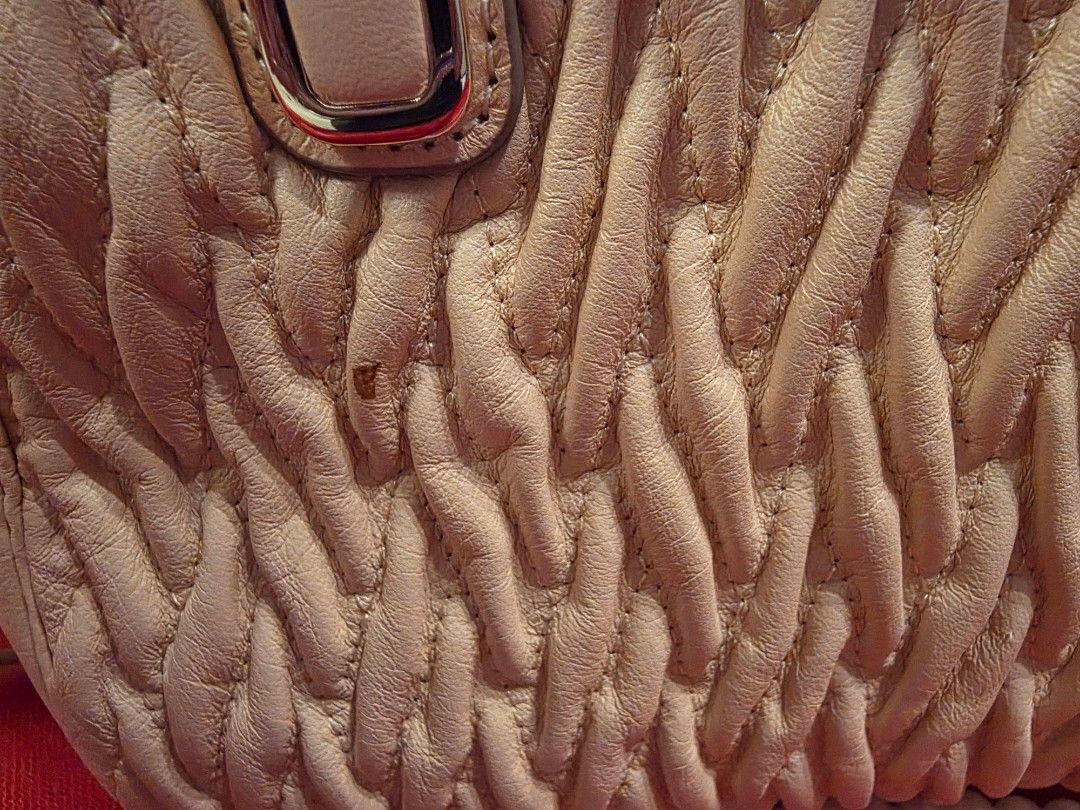 Coach Beige Quilted Leather Shoulder Bag (Category: Luxury Bags & Wallets) located in Dasmarinas. Submitted by carousel111222 (Listing ID 1449648837, Image 2). Description: -UNUSED / PRISTINE Coach Madison -Gathered Twist Leather Mini Satchel - Beige quilted leather Coach handbag with a unique woven texture. - Comes with a detachable - Versatile for everyday use or special occasions. - Clean interior. - Gold-toned hardware. - with almost unnotice